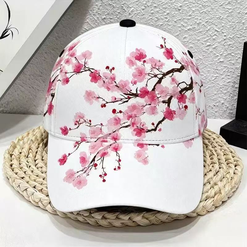 Floral print polyester cap shown front on to display the shading brim