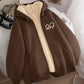 Front view of the fleece zip hoodie with the cream sherpa lining visible along the open zip