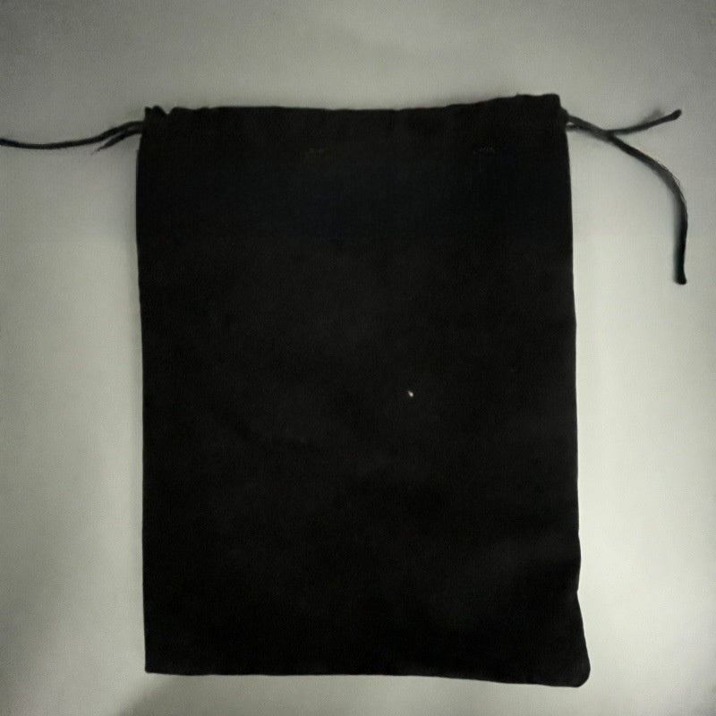 Black drawstring storage bag laid flat on a grey surface, Storage Bag option