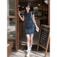 Short sleeve denim shirt dress with pointed collar and faded indigo wash