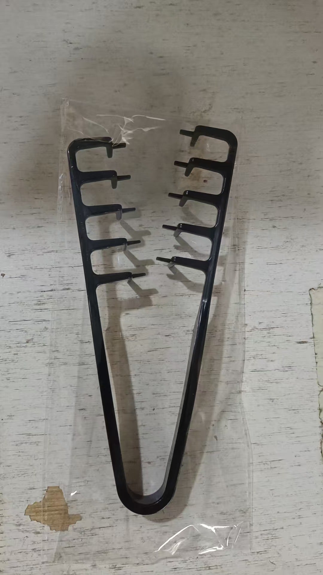 Lightweight plastic styling comb for bangs and short mens cuts on a plain background