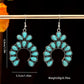 Pair of silver tone crescent drop earrings with turquoise colored stones marked 4.9 cm long, 3.7 cm wide and 20 g