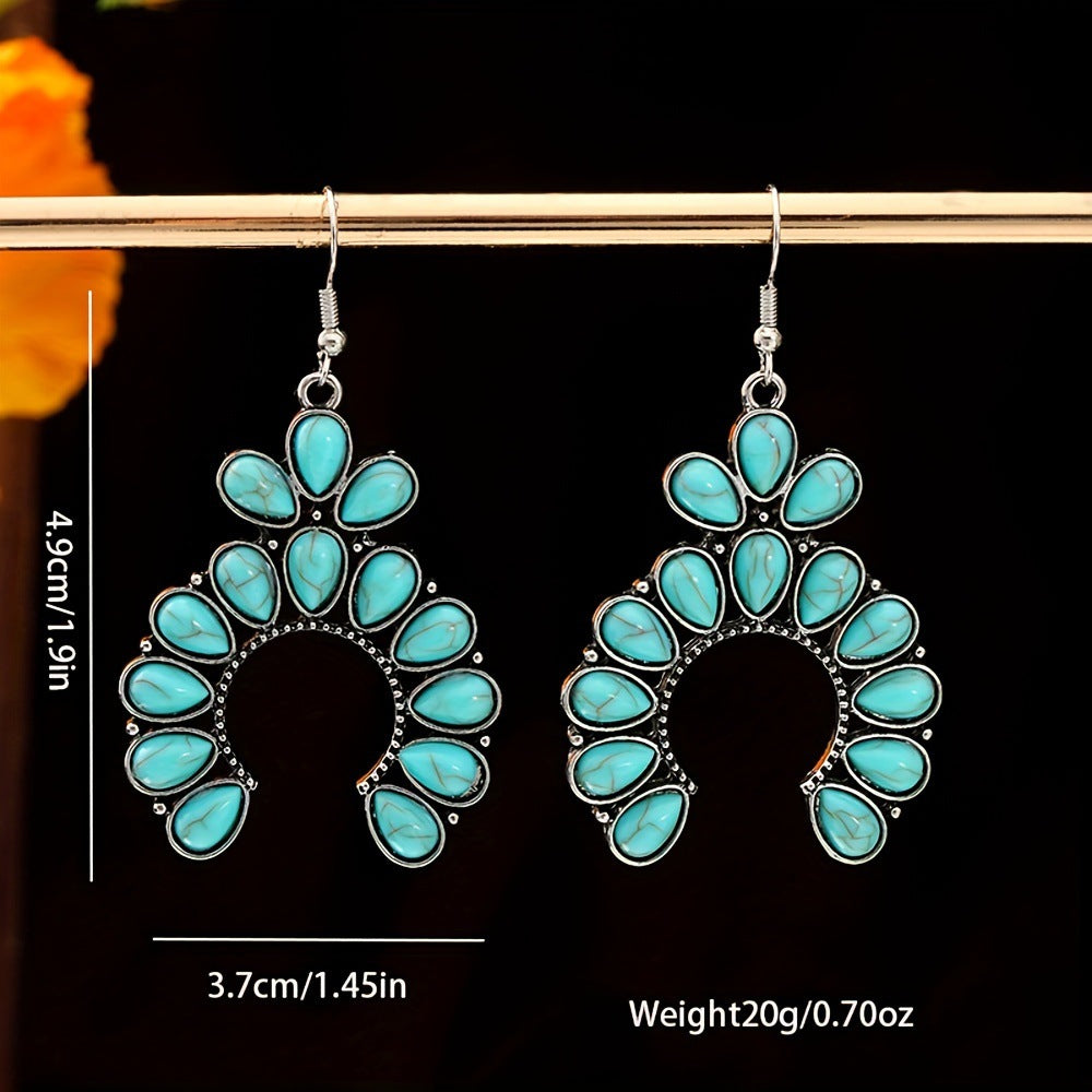 Pair of silver tone crescent drop earrings with turquoise colored stones marked 4.9 cm long, 3.7 cm wide and 20 g