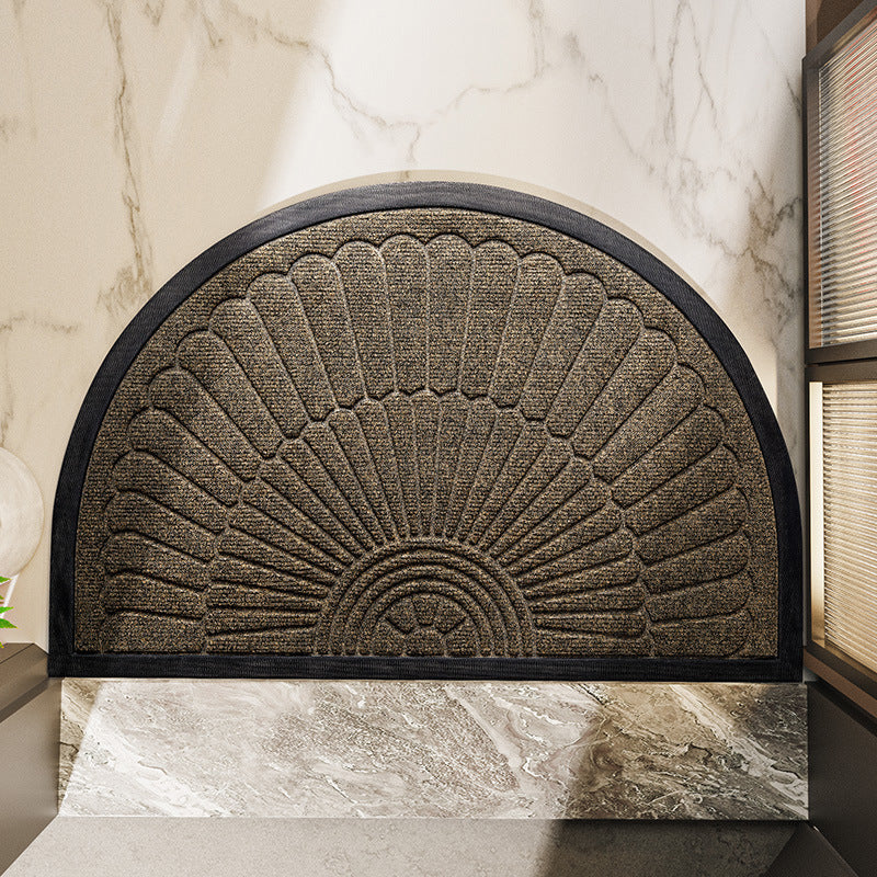 Semi circular fan relief door mat shown at a home entrance doorway