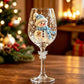 Clear wine goblet with a second painted snowman design on the glass bowl