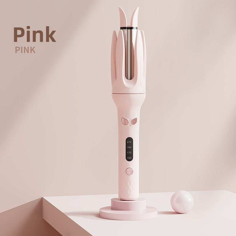 Pink automatic hair curler on a round podium, heat screen and soft control buttons on the grip