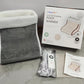 Electric heated foot warmer shown open to reveal the soft plush lining inside