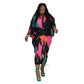 Free size pleated batwing midi dress with bold abstract print on a model, close print detail