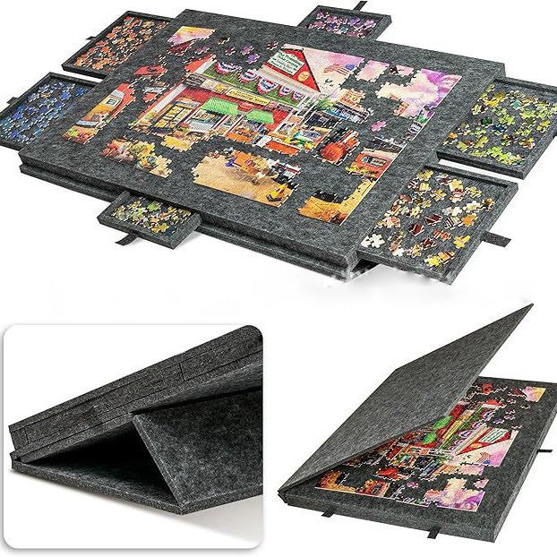 Dark gray felt puzzle board with six sorting drawers around a street scene puzzle, with folded views below