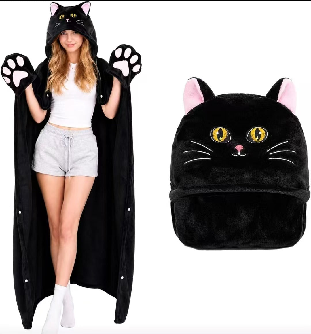 Black cat hooded cape blanket on a model with pink ears, whiskers and plush paw cuffs