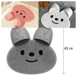 Soft TPE foot scrubbing bath mat with a dense bristle surface and two slipper shaped foot pockets