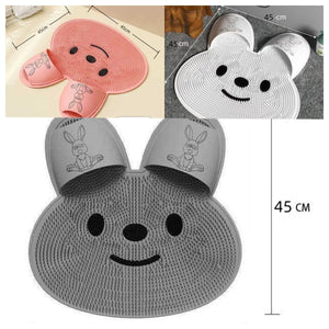 Soft TPE foot scrubbing bath mat with a dense bristle surface and two slipper shaped foot pockets