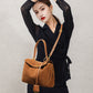 Top down view into the suede tote bag showing smooth lining and inner pocket