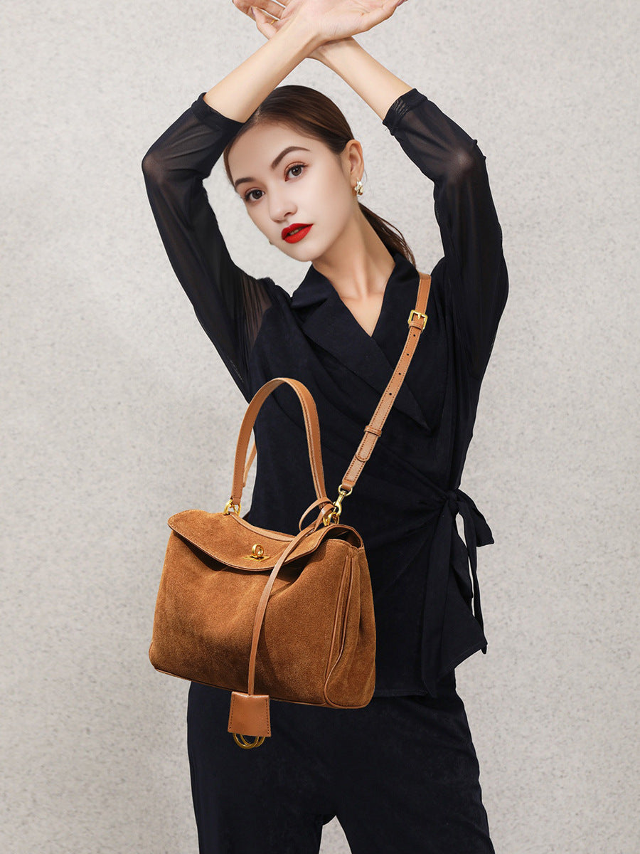 Top down view into the suede tote bag showing smooth lining and inner pocket