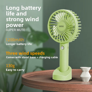 Mini USB rechargeable handheld fan, side profile showing slim pocket size shell