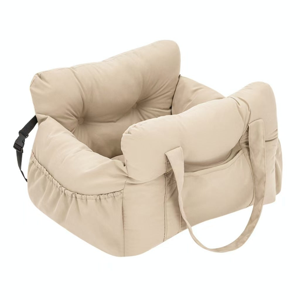 Padded car seat pet bed with raised bolster walls, carry handles and an inner clip front three quarter view of the nest