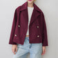 Navy dark blue cropped wool blend coat with double breasted buttons on a model