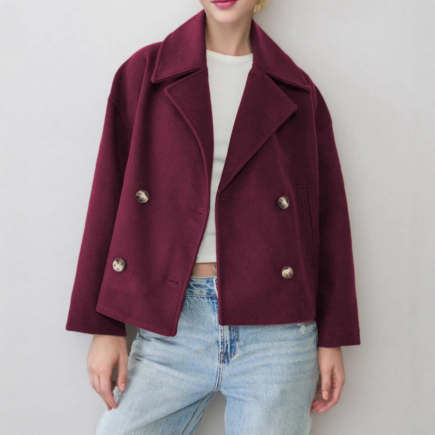 Navy dark blue cropped wool blend coat with double breasted buttons on a model