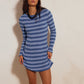 Tonal blue striped ribbed knit dress with long sleeves worn with a dark beaded necklace