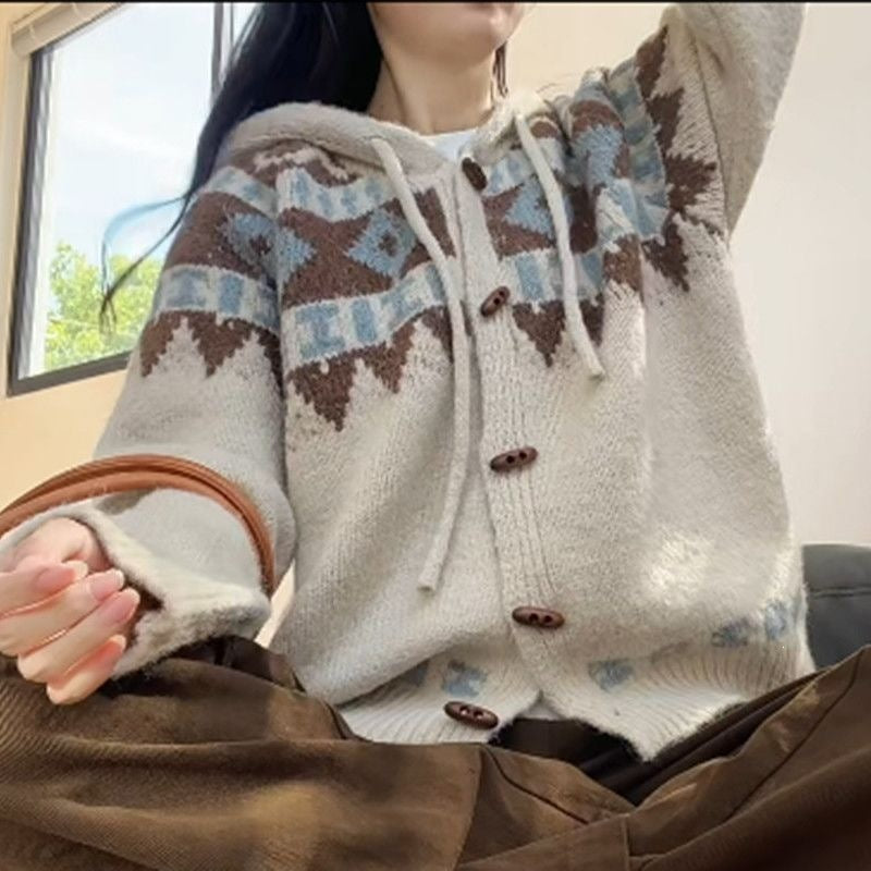 Hooded Fair Isle knit cardigan with horn-shaped buttons, worn with a tan handbag on the arm