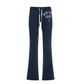 Navy flared drawstring sweatpants with white New York 1987 print flat on a white background