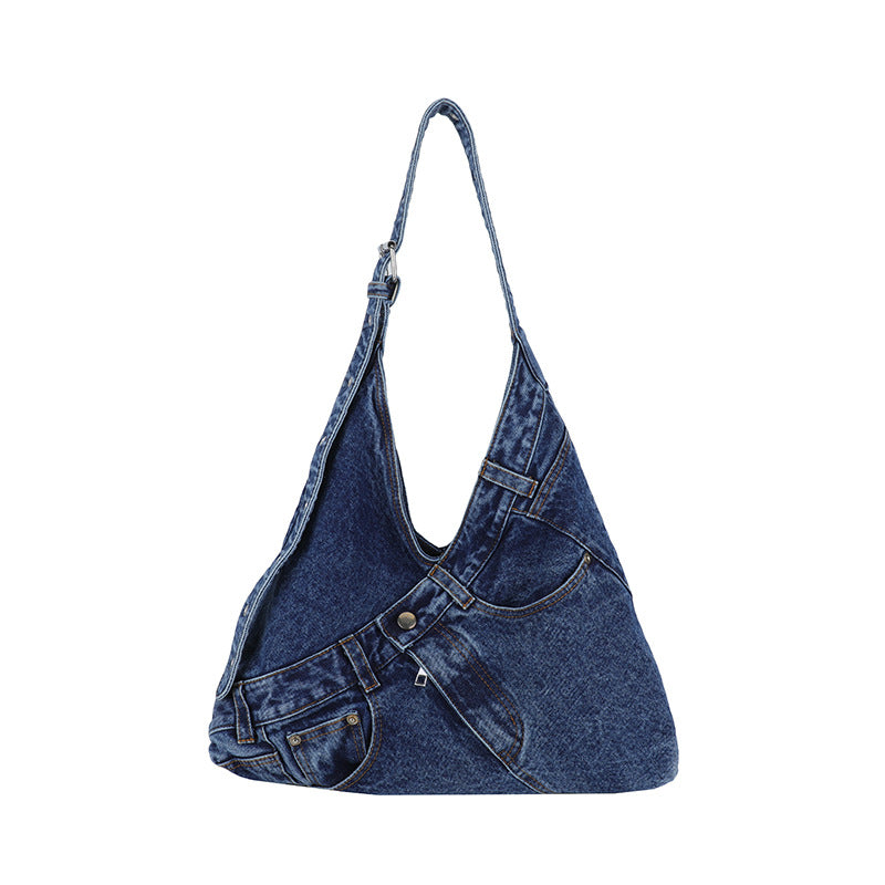 Interior of a denim shoulder bag showing zippered and slip pockets