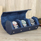 Styled watch roll with watches arranged in the cushioned slots
