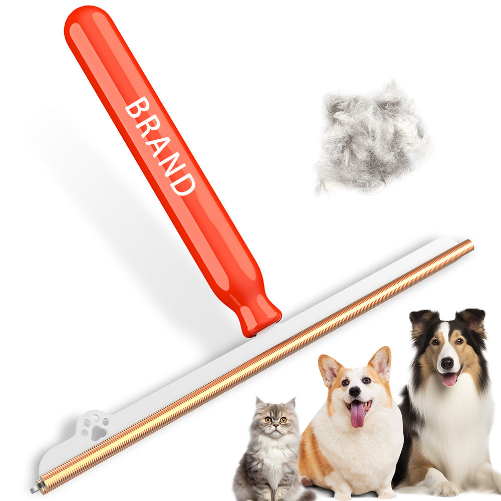 Short handle large pet hair remover brush with an orange handle, paw print base and gold-tone spiral edge