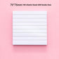 Close view of the repositionable adhesive strip on the back of a lined sticky note pad