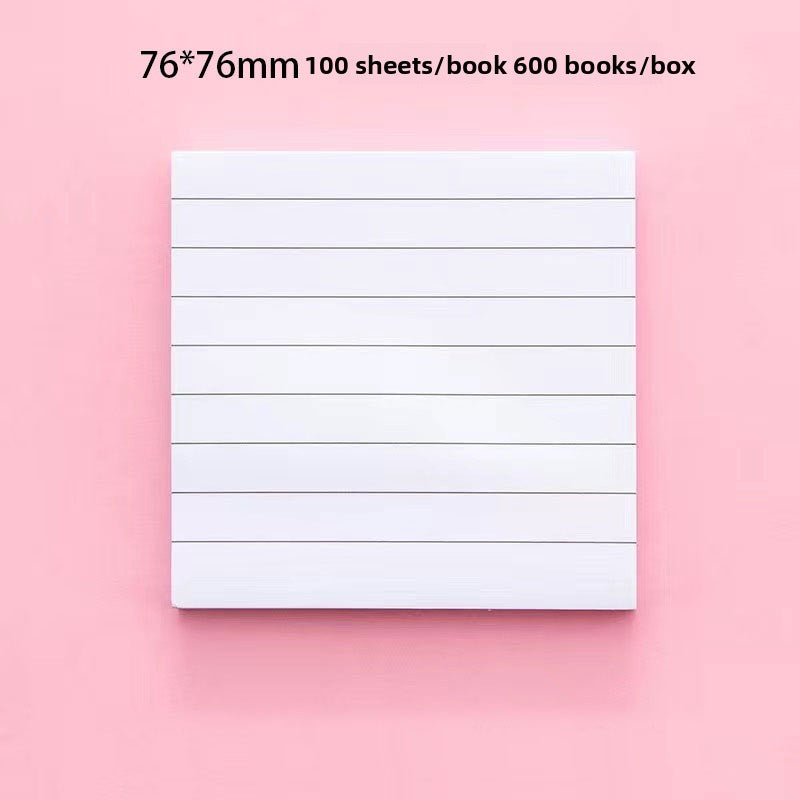 Close view of the repositionable adhesive strip on the back of a lined sticky note pad