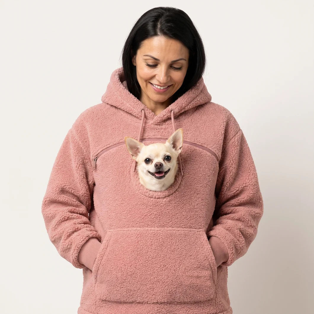 Pink teddy fleece hoodie with a small dog's head looking out of the chest opening above the front pocket