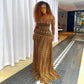 Long sleeve geometric print mesh maxi dress with a floor length gathered skirt on a standing model