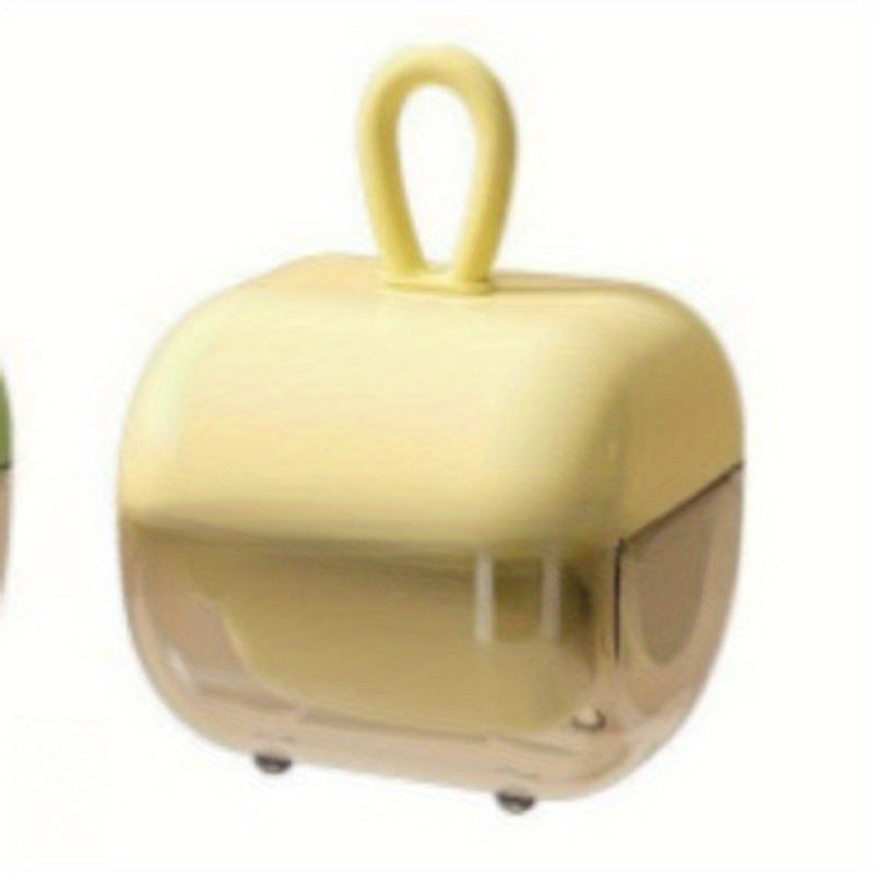 Yellow silicone lint remover cube on white, soft hanging loop on top and tinted lower housing