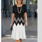Floral print short sleeve dress showing the knee length overlapping front hem