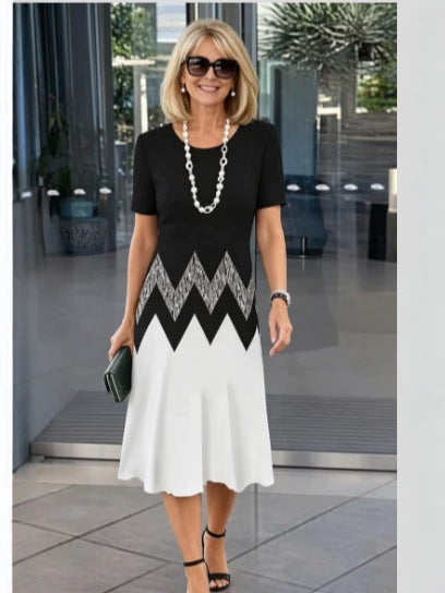 Floral print short sleeve dress showing the knee length overlapping front hem