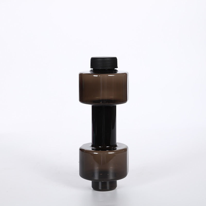 Top view of the black screw cap with fold down carry handle and white flip top spout