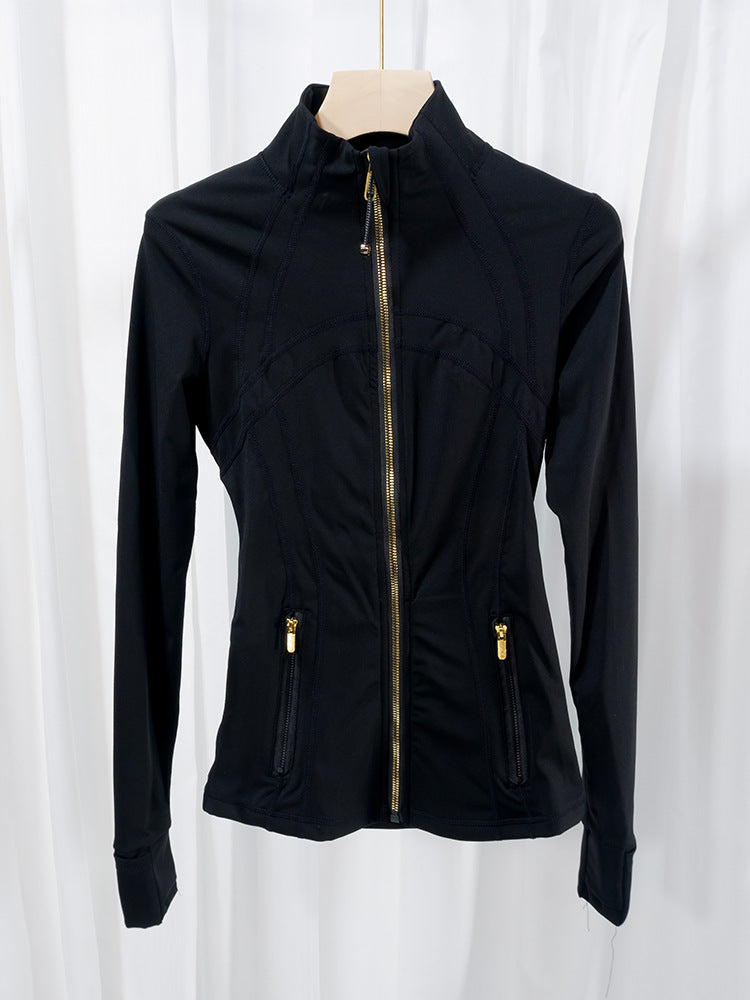 Outfit shot, running jacket paired with leggings and trainers on path