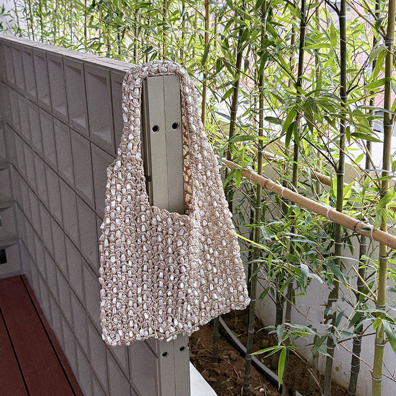 Ivory beaded crochet net bag styled with a plain everyday outfit
