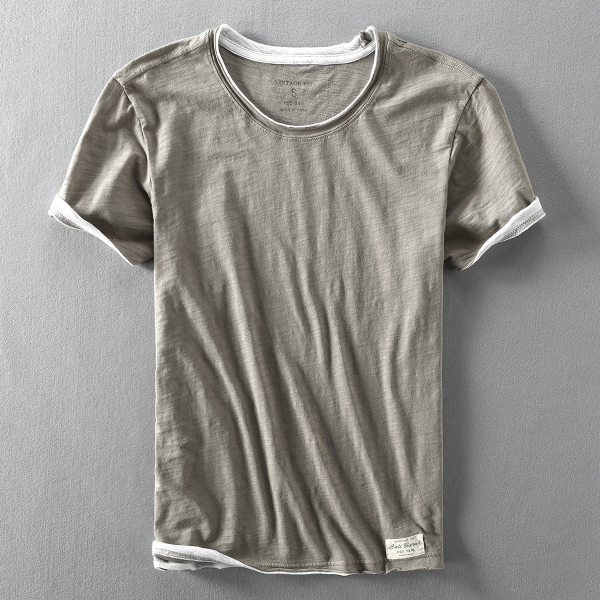 Light gray washed slub cotton short sleeve tee, front flat lay with contrast trim, size S