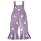 Lavender Purple ribbed flared overalls with white embroidered ghosts and a ruffled hem, front view