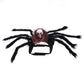 Black plush spider Halloween costume for cats and dogs with a gauze accent skull and eight legs