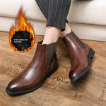 Man in striped trousers wearing brown slip-on Chelsea boots on a wooden floor, flame icon Add cotton for warmth