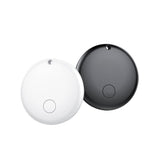 White and black round Bluetooth item tracker tags side by side on a white background