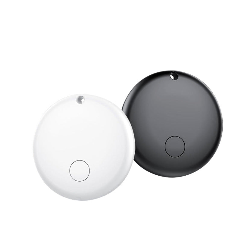 White and black round Bluetooth item tracker tags side by side on a white background