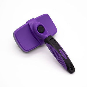 Purple ABS self cleaning pet slicker brush shown from the top with the retract button on the head