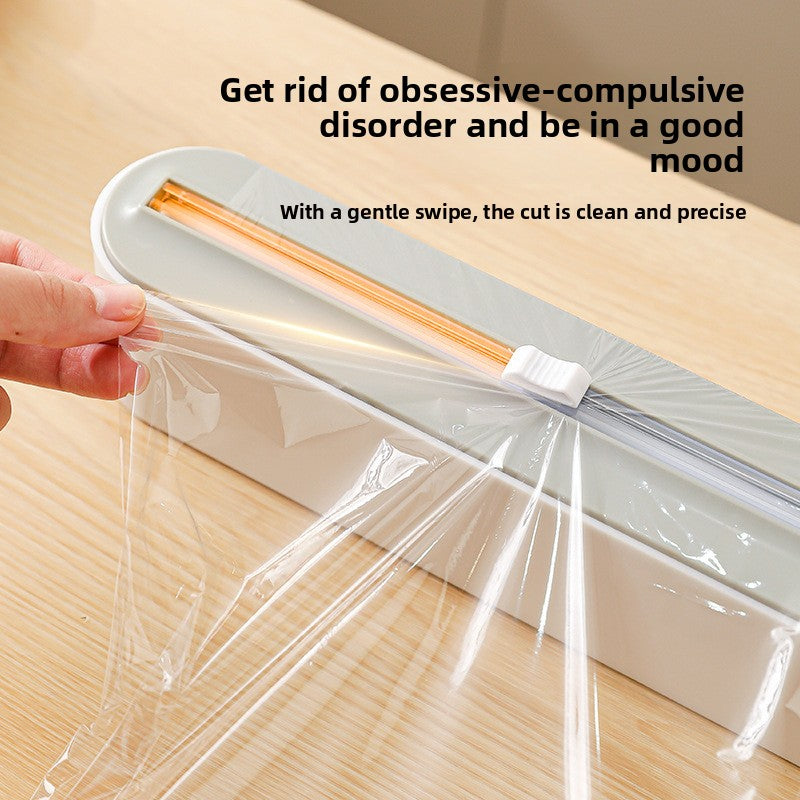 Close-up of the guarded slide cutter blade on the food wrap dispenser