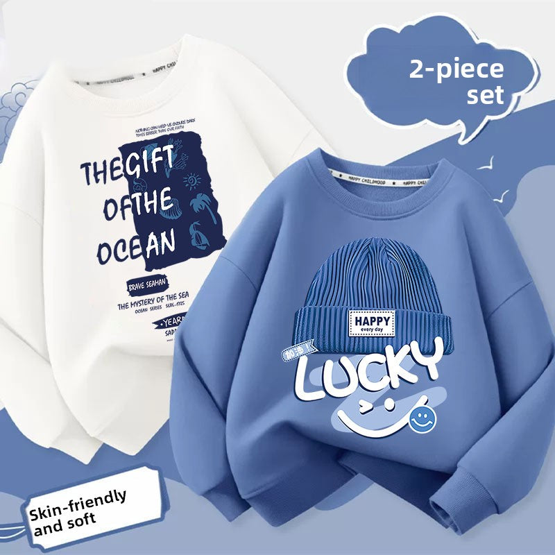 Front view of a boys orange cartoon print sweatshirt showing a dragon claw graphic print
