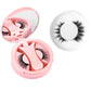 Pink round magnetic lash case open beside a soft natural black magnetic lash in a ring