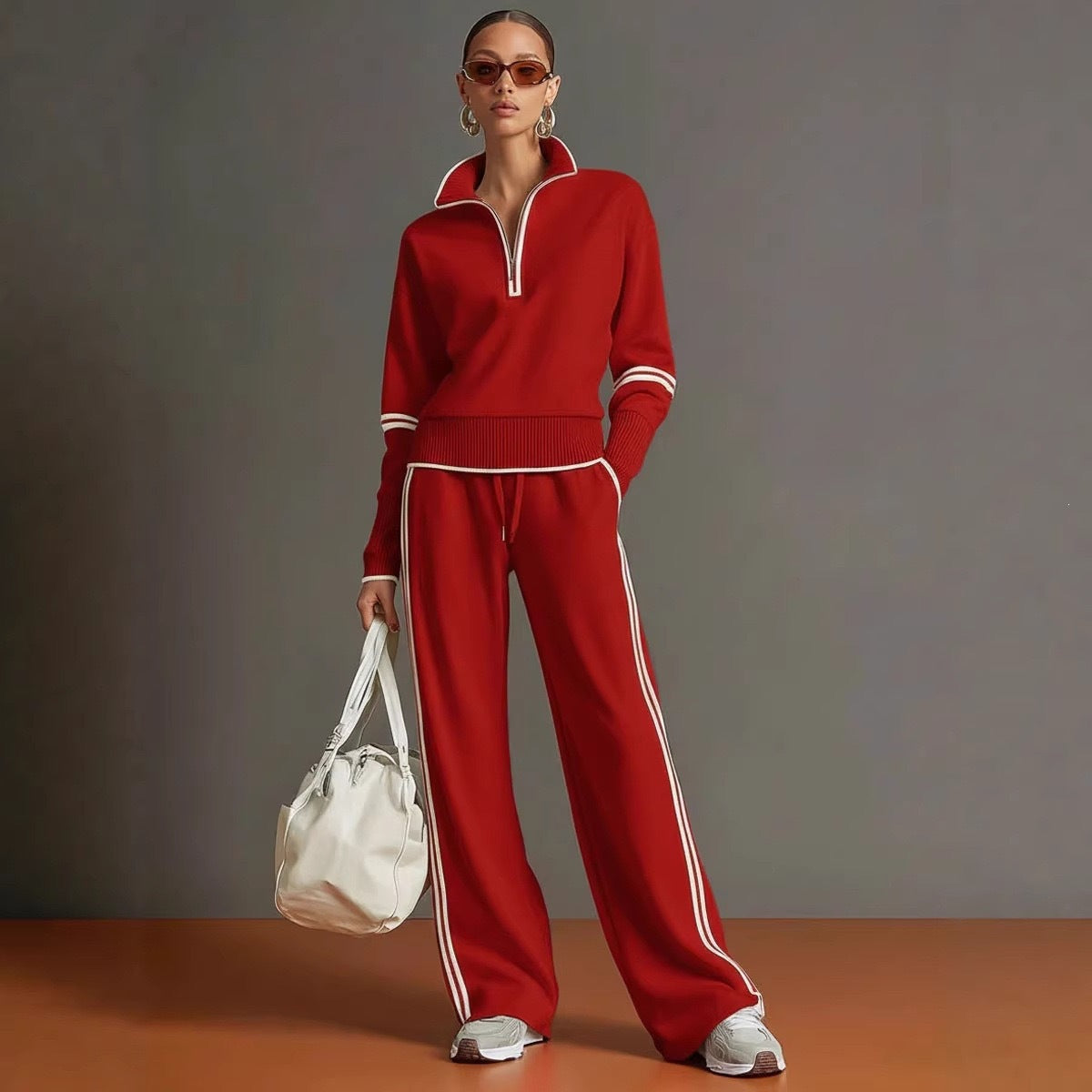 Model wearing the Red half zip sweatshirt set, white piping and wide leg pants