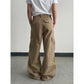 Distressed khaki loose-fit casual pants worn in a relaxed everyday setting